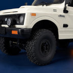 WPL C74 Jimny RTR — voiture RC crawler 1/10 — gros plan de la carrosserie et des pneus — Gift Mello
