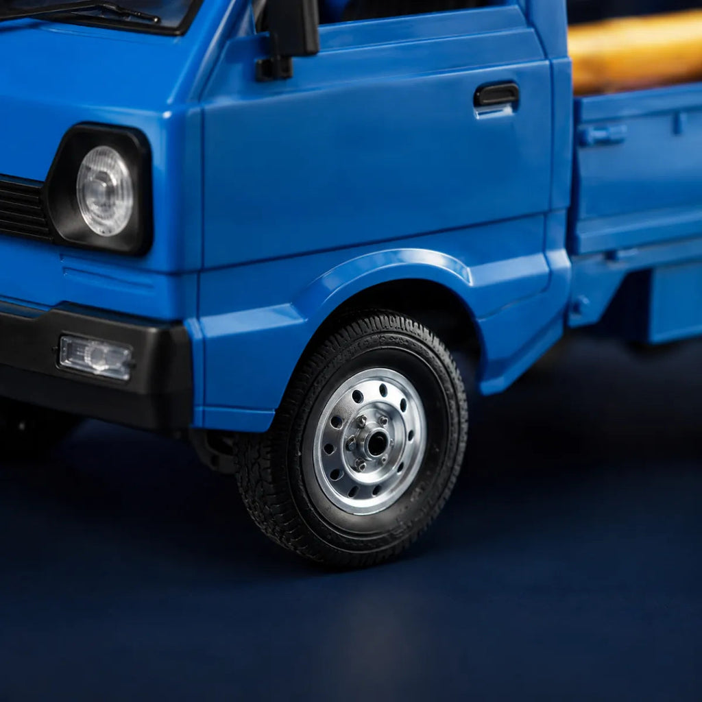 WPL D12 Kei Truck RTR — voiture RC route 1/10 — gros plan de la carrosserie et des pneus — Gift Mello